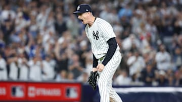 Oct 7, 2025; Bronx, New York, USA; New York Yankees relief pitcher Tim Hill (41) reacts after the last out in the fifth inning against the Toronto Blue Jays during game three of the ALDS round for the 2025 MLB playoffs at Yankee Stadium. Mandatory Credit: Wendell Cruz-Imagn Images