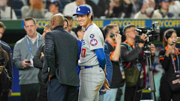 Mar 18, 2025; Bunkyo, Tokyo, JPN; Los Angeles Dodgers designated hitter Shohei Ohtani (17) (center) smiles after defeating the Chicago Cubs during the Tokyo Series at Tokyo Dome. 