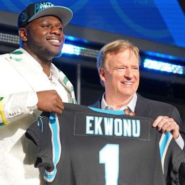 Apr 28, 2022; Las Vegas, NV, USA; North Carolina State offensive tackle Ikem Ekwonu with NFL commissioner Roger Goodell after being selected as the sixth overall pick to the Carolina Panthers during the first round of the 2022 NFL Draft at the NFL Draft Theater. Mandatory Credit: Kirby Lee-Imagn Images