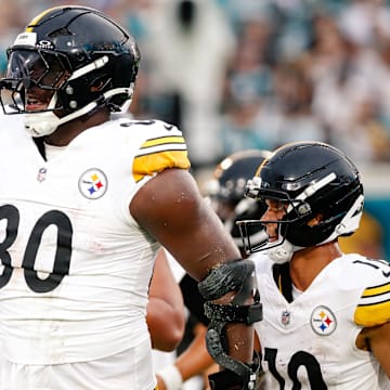 Aug 9, 2025; Jacksonville, Florida, USA; Pittsburgh Steelers tight end Darnell Washington (80) celebrates after scoring a touchdown against the Jacksonville Jaguars during a preseason game at EverBank Stadium. Mandatory Credit: Travis Register-Imagn Images
