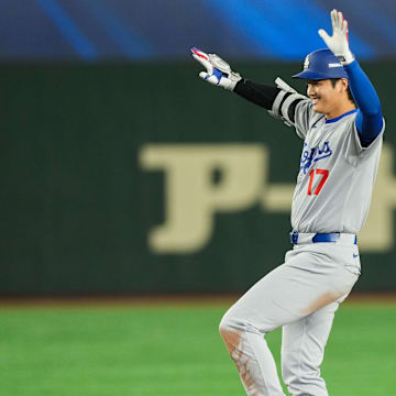 Mar 18, 2025; Bunkyo, Tokyo, JPN; Los Angeles Dodgers designated hitter Shohei Ohtani (17) reacts after hitting a double in the ninth inning against the Chicago Cubs during the Tokyo Series at Tokyo Dome. Mandatory Credit: Darren Yamashita-Imagn Images