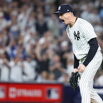 Oct 7, 2025; Bronx, New York, USA; New York Yankees relief pitcher Tim Hill (41) reacts after the last out in the fifth inning against the Toronto Blue Jays during game three of the ALDS round for the 2025 MLB playoffs at Yankee Stadium. Mandatory Credit: Wendell Cruz-Imagn Images