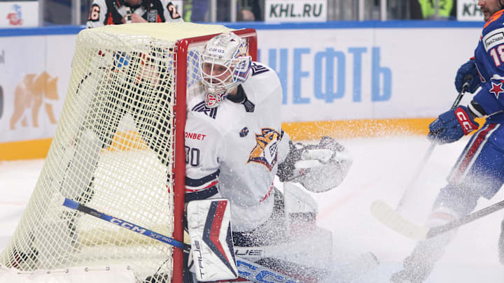 Ilya Nabokov (30) of Metallurg Hockey Club seen in action...