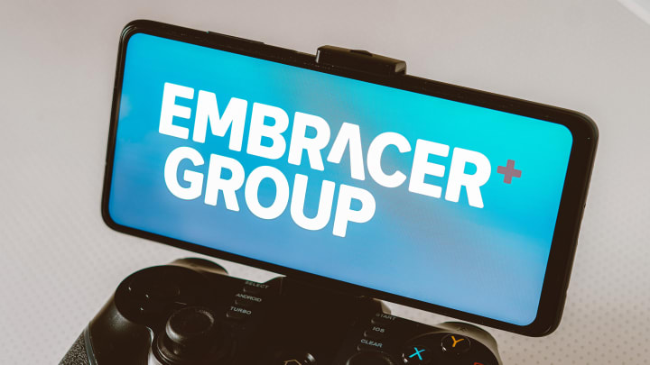 In this photo illustration, the Embracer Group logo is seen...