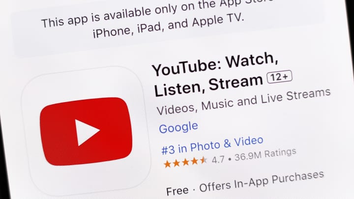 In this photo illustration, the YouTube app is seen on the...