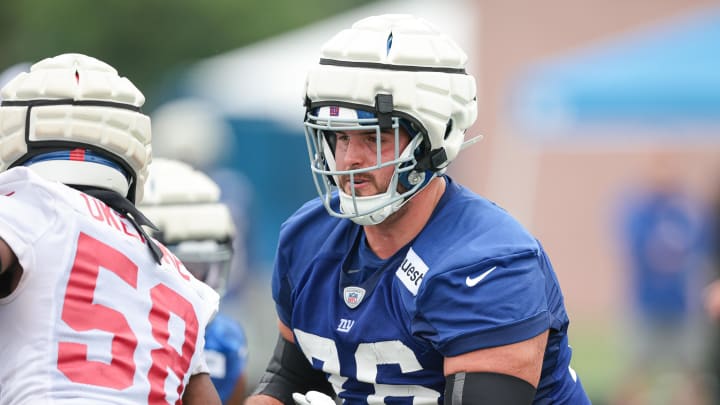 Jul 24, 2024; East Rutherford, NJ, USA; New York Giants guard Jon Runyan (76) blocks linebacker Bobby Okereke (58) during training camp at Quest Diagnostics Training Facility.  