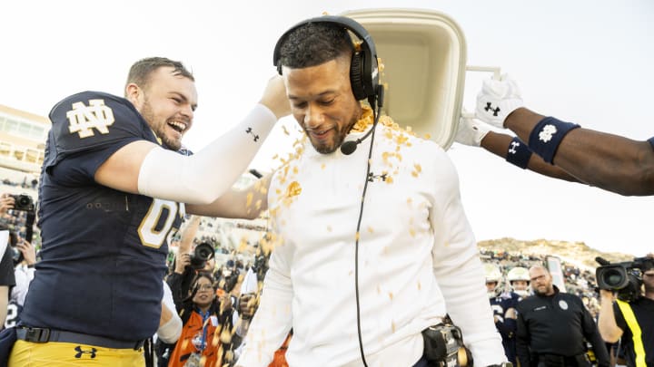 Dec 29, 2023; El Paso, TX, USA; Notre Dame football head coach Marcus Freeman is showered with Frosted Flakes after defeating the Oregon State Beavers 40-8 in the Tony the Tiger Sun Bowl at Sun Bowl Stadium. Mandatory Credit: Ivan Pierre Aguirre-USA TODAY Sports