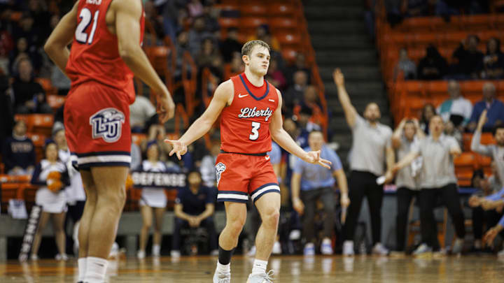 Feb 3, 2024; El Paso, Texas, USA; Liberty University Flames guard Kaden Metheny (3) celebrates after scoring a three pointer against the UTEP Miners defense in the first half at Don Haskins Center. Mandatory Credit: Ivan Pierre Aguirre-Imagn Images Feb 3, 2024; El Paso, Texas, USA; Liberty University Flames guard Kaden Metheny (3) celebrates after scoring a three pointer against the UTEP Miners defense in the first half at Don Haskins Center. Mandatory Credit: Ivan Pierre Aguirre-Imagn Images