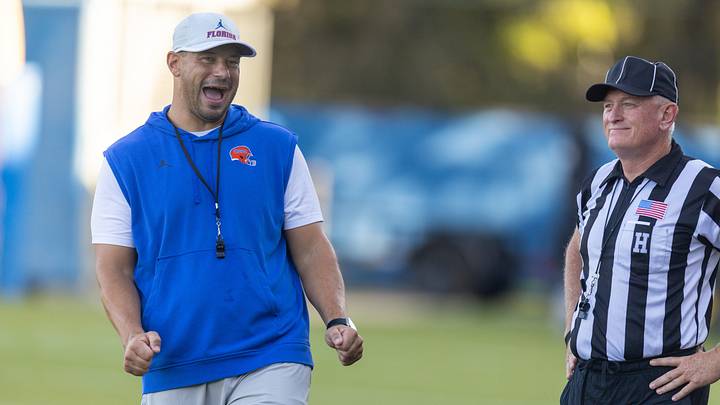 Florida Head Coach Jon Sumrall, left, watches practice with referees at Heavener Football Complex in Gainesville, FL on Tuesday, August 11, 2026. [Alan Youngblood/Gainesville Sun]