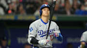 Mar 18, 2025; Bunkyo, Tokyo, JPN; Los Angeles Dodgers designated hitter Shohei Ohtani (17) walks to the plate before an at-bat in the fifth inning against the Chicago Cubs during the Tokyo Series at Tokyo Dome. Mandatory Credit: Darren Yamashita-Imagn Images