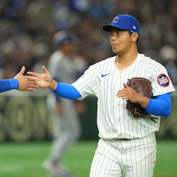 Mar 18, 2025; Bunkyo, Tokyo, JPN; Chicago Cubs starting pitcher Shota Imanaga (18) (right) shakes hands with catcher Miguel Amaya (9) (left) after the top of the second inning concludes against the Los Angeles Dodgers during the Tokyo Series at Tokyo Dome.