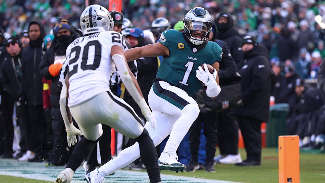 Dec 14, 2025; Philadelphia, Pennsylvania, USA; Philadelphia Eagles quarterback Jalen Hurts (1) runs the ball against Las Vegas Raiders safety Isaiah Pola-Mao (20) during the third quarter at Lincoln Financial Field. Mandatory Credit: Bill Streicher-Imagn Images