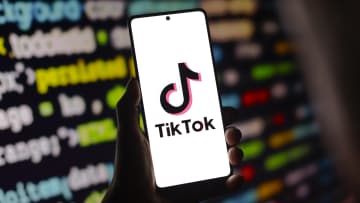 In this photo illustration, the TikTok logo is displayed on...