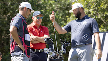 Feb 2, 2024; Playa del Carmen, Quintana Roo, MEX; Jon Rahm of Team Legion XIII, right, shows LIV CEO Greg Norman one of his clubs on the first tee during the fist round of the LIV Golf Mayakoba tournament at El Chamaleon Golf Course. Mandatory Credit: Erich Schlegel-Imagn Images