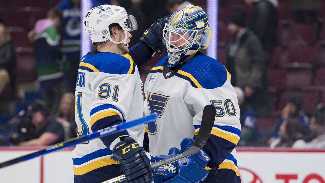 Dec 19, 2022; Vancouver, British Columbia, CAN; St. Louis Blues forward Vladimir Tarasenko (91) and goalie Jordan Binnington (50) celebrate their victory against the Vancouver Canucks at Rogers Arena. Mandatory Credit: Bob Frid-Imagn Images