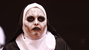A person dressed as a nun taking part during the annual...