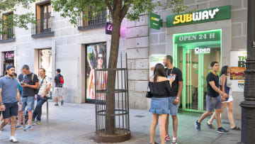 Pedestrians are seen outside the American sandwich fast food...