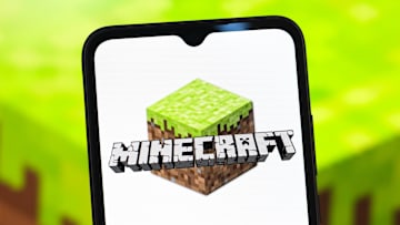 In this photo illustration, the Minecraft logo is seen...