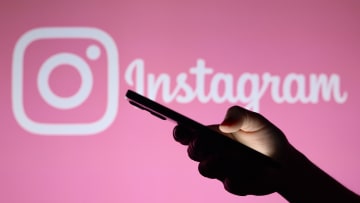 In this photo illustration, the Instagram logo seen in the...