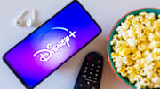 In this photo illustration, the Disney+ (Plus) logo seen...