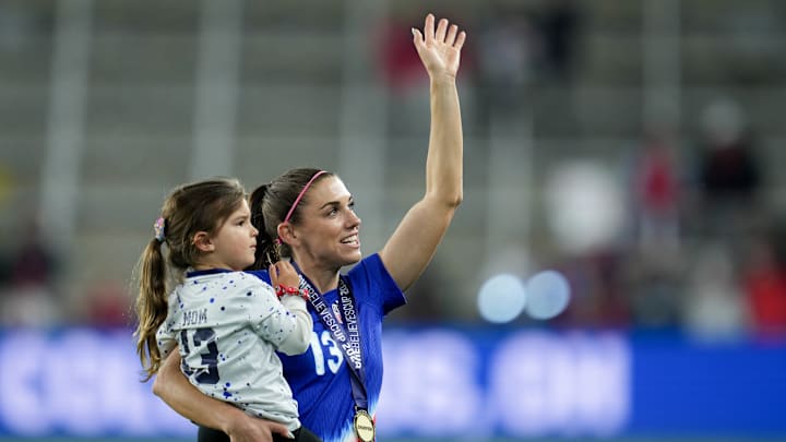 Alex Morgan waves with daughter Charlie after Canada v USWNT match