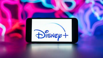 In this photo illustration, the Disney logo is seen...