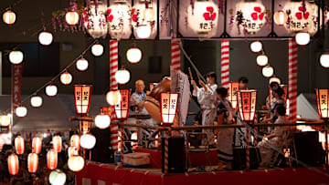 Taiko drummers perform songs on a Yagura (wooden scaffold)...