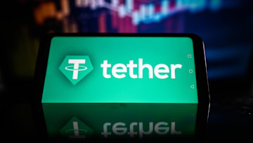 In this photo illustration  a Tether logo is displayed on a