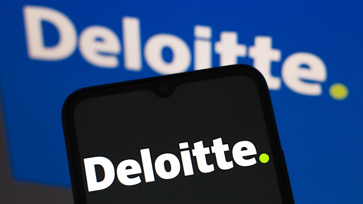 In this photo illustration, the Deloitte Touche Tohmatsu...