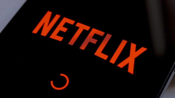 In this photo illustration, the Netflix streaming app logo...