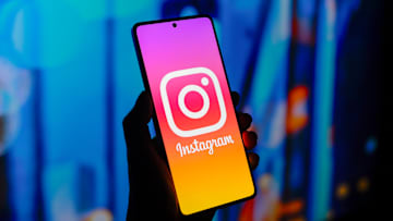 In this photo illustration, the Instagram logo is displayed...