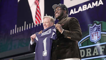 Alabama Crimson Tide offensive lineman Tyler Booker poses with NFL commissioner Roger Goodell after he is selected by the Dallas Cowboys as the number twelve pick in the first round of the 2025 NFL Draft at Lambeau Field.