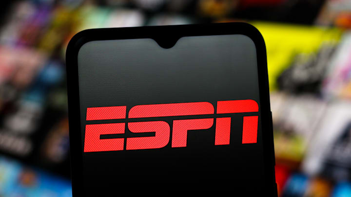 In this photo illustration, the ESPN (Entertainment and...