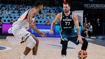 Luka Doncic (R) of Slovenia and Johannes Thiemann (L) seen...