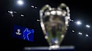 A scoreboard displays the logo of the UEFA Champions League...
