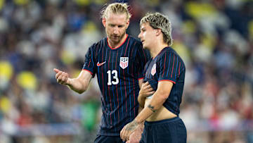 Tim Ream and John Tolkin talk during the USMNT's 4-0 loss to Switzerland.