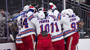 Nov 1, 2025; Seattle, Washington, USA;  The New York Rangers celebrate an overtime win against the Seattle Kraken at Climate Pledge Arena. Mandatory Credit: Blake Dahlin-Imagn Images