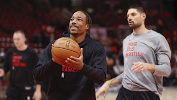 Nov 6, 2023; Chicago, Illinois, USA; Chicago Bulls forward DeMar DeRozan (11) and center Nikola Vucevic (9) warm up before a basketball game against the Utah Jazz at United Center. Mandatory Credit: Kamil Krzaczynski-Imagn Images