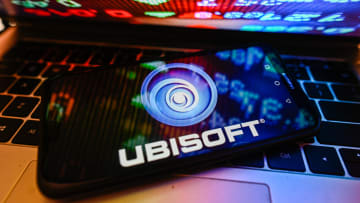 In this photo illustration a UbiSoft logo is displayed on a...