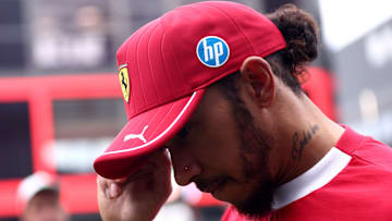 Lewis Hamilton of Scuderia Ferrari looks dejected at the end...
