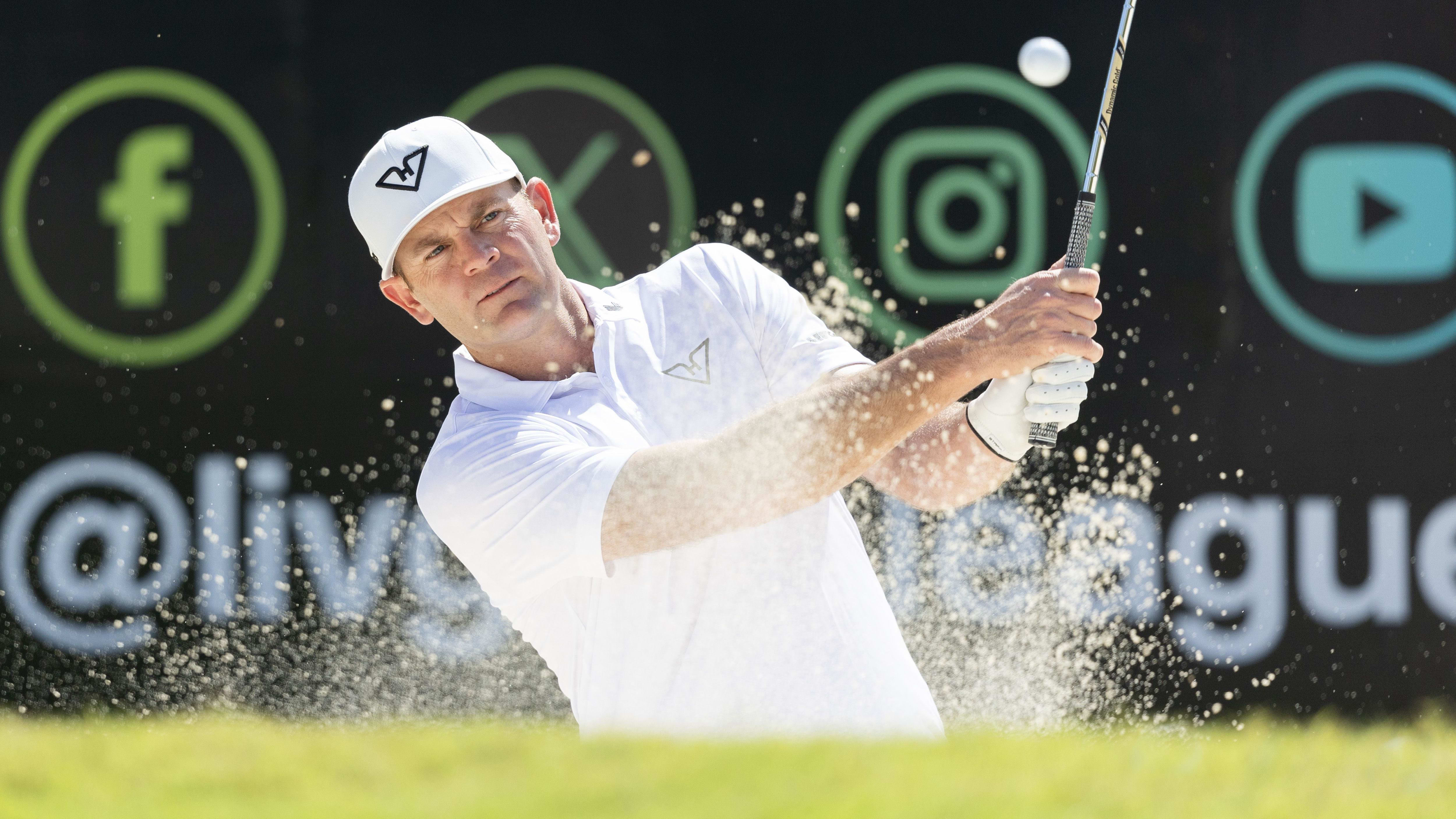 Brendan Steele hits from a bunker in a LIV Golf event.