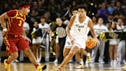 Feb 11, 2025; Orlando, Florida, USA;  Central Florida Knights center Keyshawn Hall (4) dribbles the ball up the court while Iowa State Cyclones guard Tamin Lipsey (3) attempts to defend at Addition Financial Arena. Mandatory Credit: Russell Lansford-Imagn Images