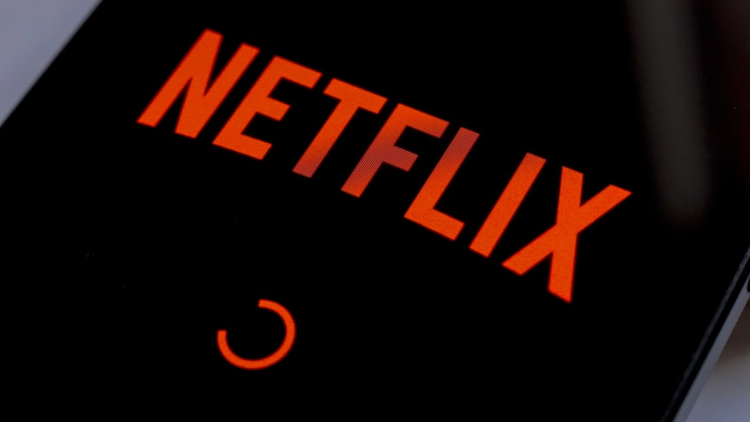 In this photo illustration, the Netflix streaming app logo...