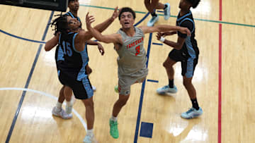 July 17, 2024; North Augusta, S.C., USA; Team Takeover's Derek Dixon (3) shoots the ball as WhyNot's Tae Simmons (15) defends during the Team Takeover and WhyNot game at the Nike Peach Jam at Riverview Park Activities Center. Team Takeover won 64-62. Mandatory Credit: Katie Goodale-USA TODAY Network