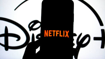 In this photo illustration, a Netflix logo seen displayed on...