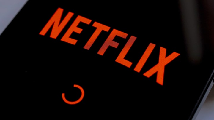 In this photo illustration, the Netflix streaming app logo...