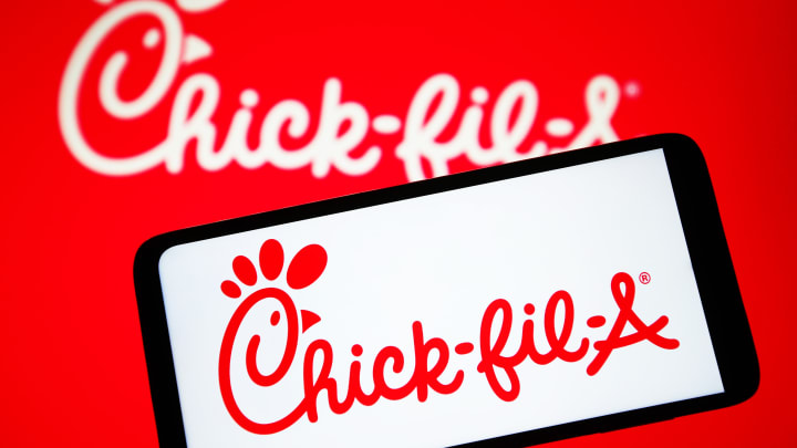 In this photo illustration, Chick-fil-A logo is seen on a...