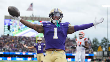 Washington running back Jonah Coleman (1) and quarterback Demond Williams Jr. (2) celebrate the former's second receiving touchdown of the season, which was thrown from receiver Denzel Boston to Coleman during the Huskies' 42-25 Week 9 win over the Illinois Fighting Illini on Oct. 25, 2025.