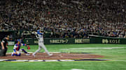 Los Angeles Dodgers designated hitter Shohei Ohtani hits a home run against the Chicago Cubs in the Tokyo Series. 