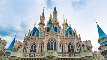 The Cinderella Castle during an overcast day is seen in the...